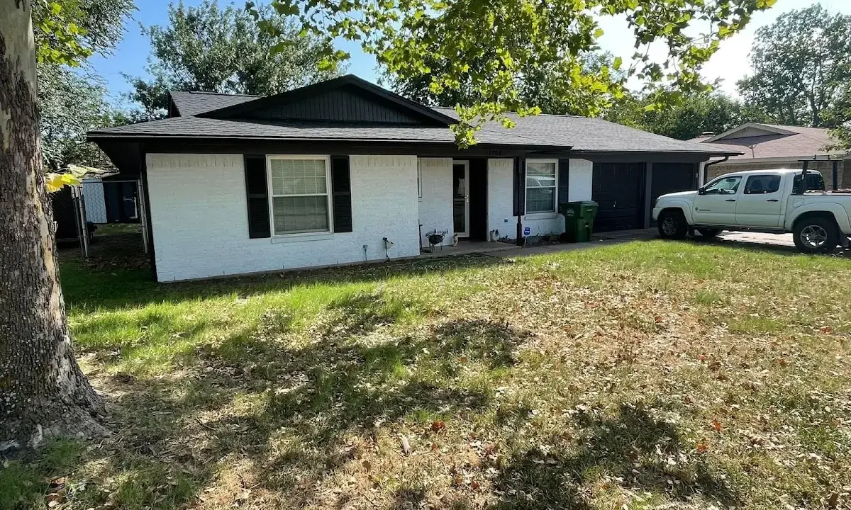 Professional roofing crew working on a residential roof in St. Helena